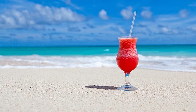 a fruity drink on the beach